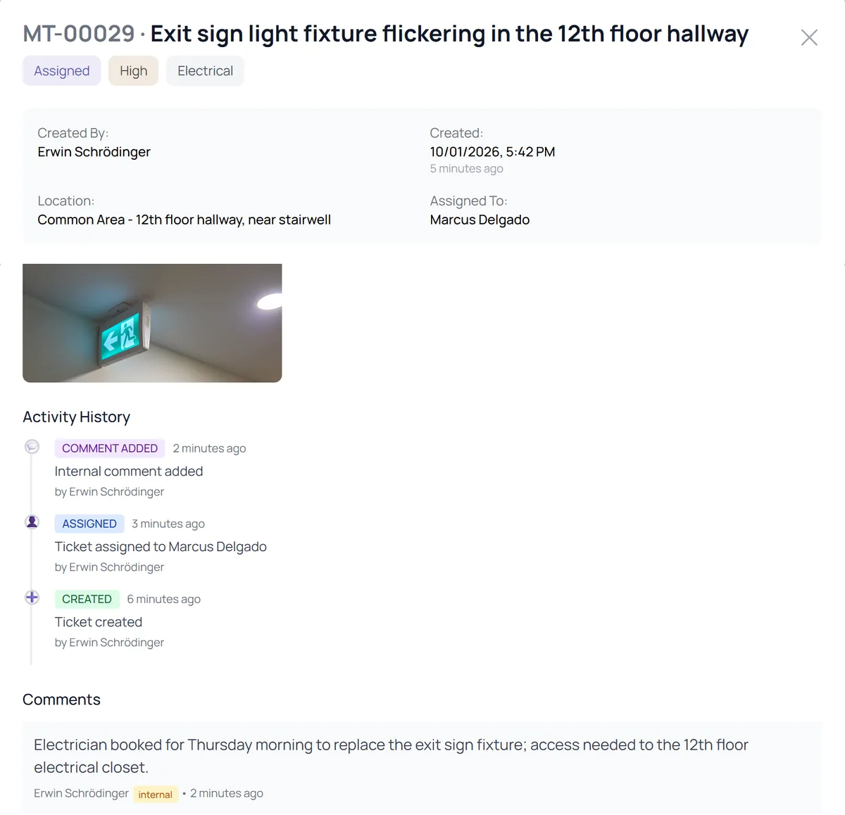 A maintenance request assigned to a staff member, with its photo, history, and an internal comment